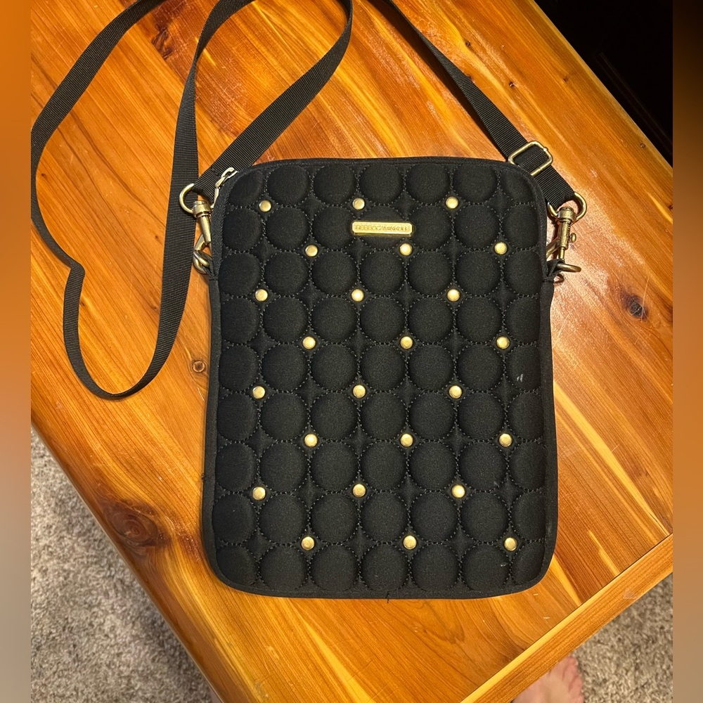 Black padded I pad cross body, can be used as a purse or iPad case. Brand new.